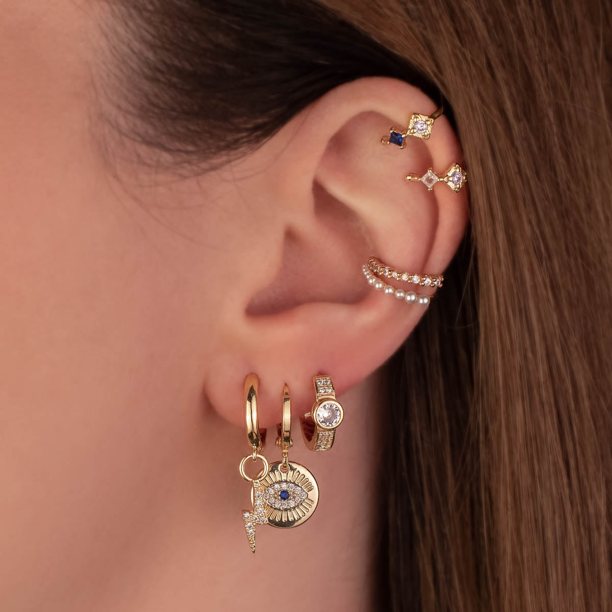 Sigrid Evil Eye White and Blue Zircon Huggie Earrings