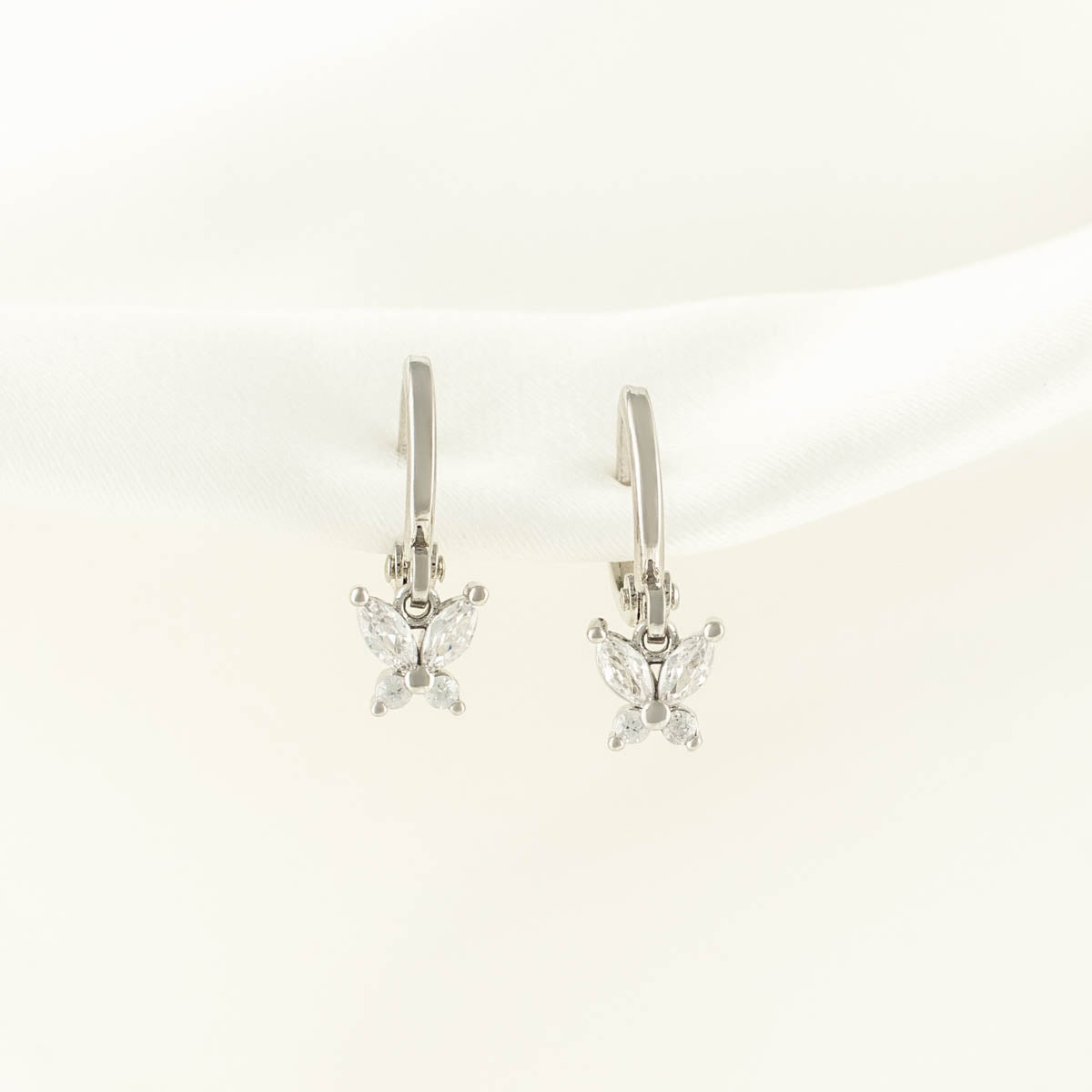 Gwendolyn White Zircon Butterfly Huggie Earrings