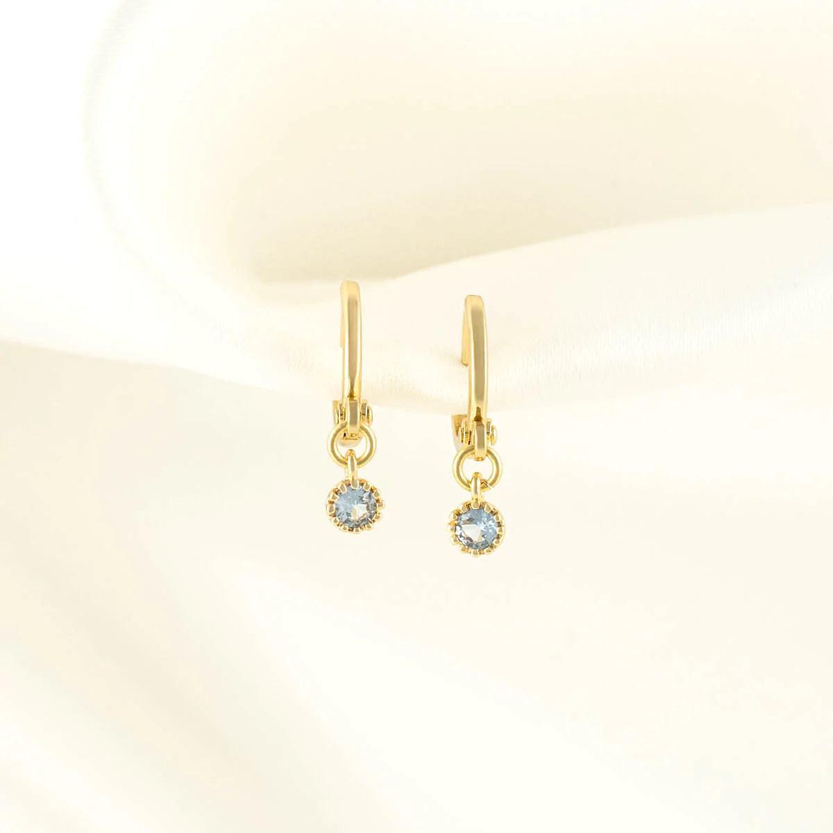 Daphne Blue Zircon Huggie Earrings